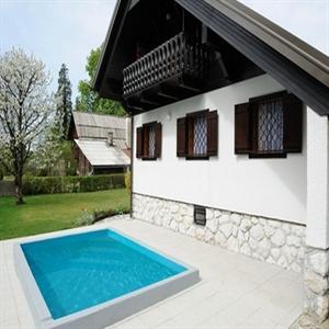 Private pool and sun-beds with umbrellas