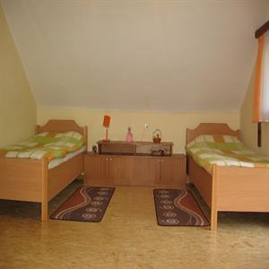 First floor bedroom with three beds