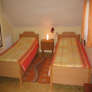 First floor bedroom with two beds